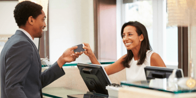 hotel guest checking in at counter