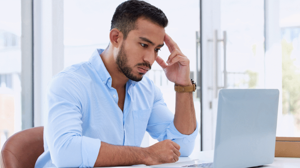 man sitting at computer