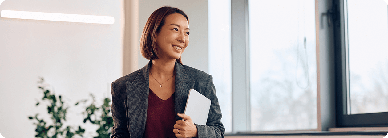 woman holding laptop