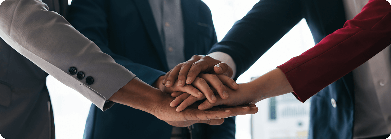 Team hands coming together