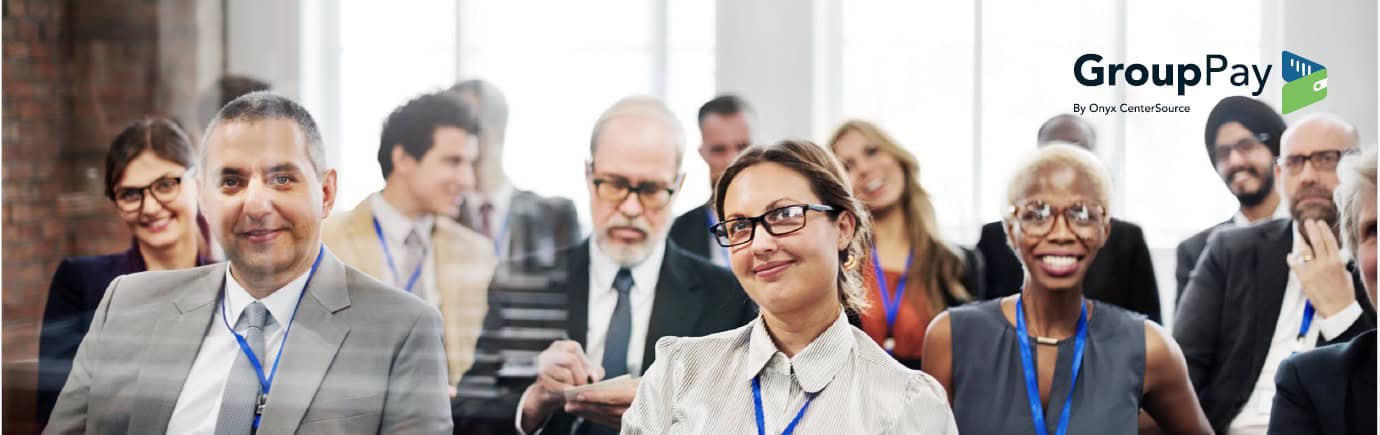 Diverse business professionals wearing blue lanyards at a conference, with the GroupPay by Onyx CenterSource logo in the top right.
